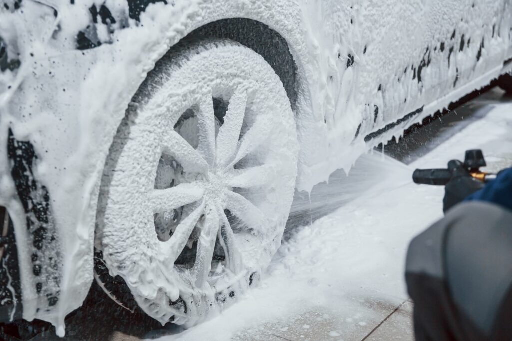 Using snow foam on a car in Portsmouth to effectively remove dirt and contaminants, enhancing paint protection and shine.